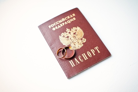 gold wedding rings on whiteの写真素材