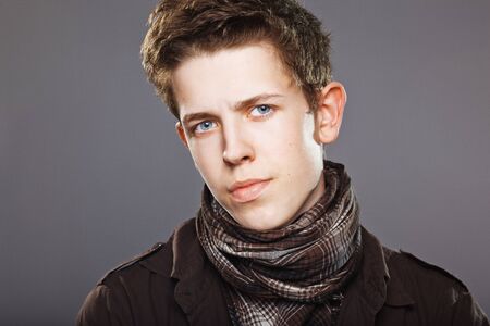attractive young man wearing elegant shirt and  scarfの写真素材
