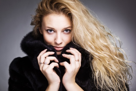 beautiful fashionable woman in black furの写真素材