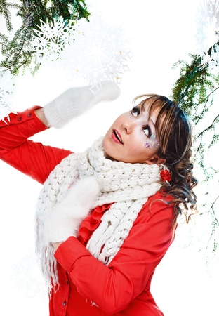 beautiful woman in warm clothing with white mittenの写真素材