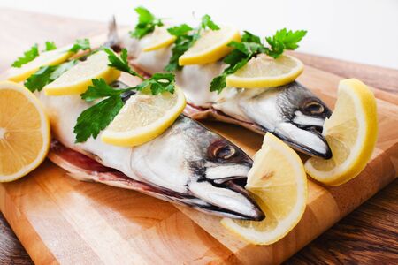 couple of fresh mackerel on wood