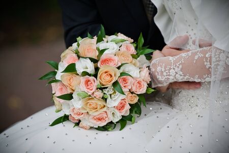 Bride with wedding  bouquet, closeupの写真素材