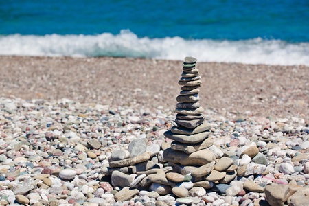 pyramid of stones on the beachの写真素材