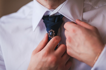 Groom set the bowtie straightの写真素材