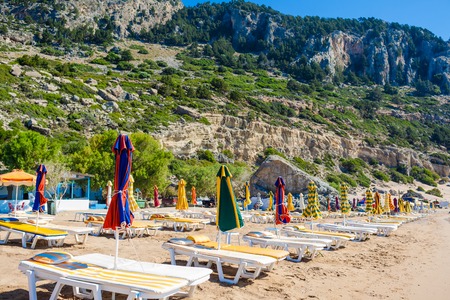 view of the beach with chairs and umbrellas. Greeceのeditorial素材