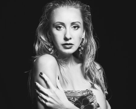 Young woman studio fashion portrait. Black and white.の写真素材