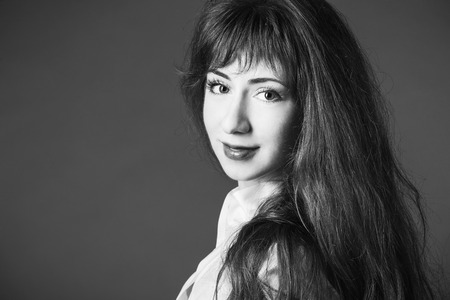 Young woman studio fashion portrait. Black and white.の写真素材