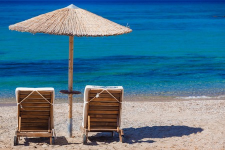 view of the beach with chairs and umbrellas. Greeceの写真素材