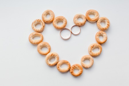 gold wedding rings on whiteの写真素材