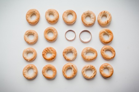 gold wedding rings on whiteの写真素材