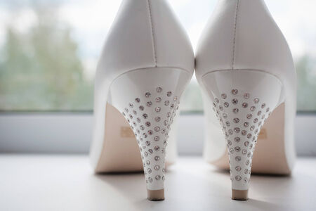 closeup photo of beautiful bride's shoesの写真素材