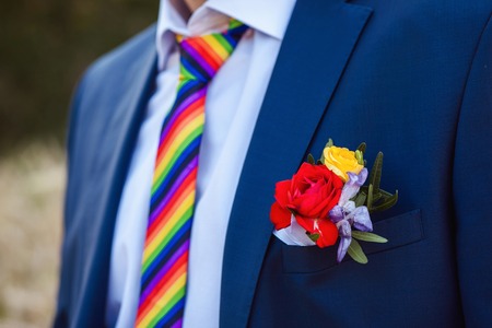 Groom with the boutonniere and tie