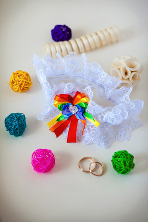 A white linen garter with a coloured bowの写真素材
