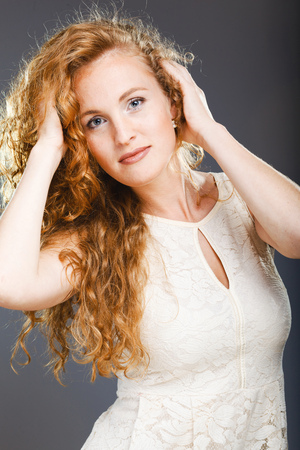 Portrait of beautiful lady on grey. Studio shotの写真素材