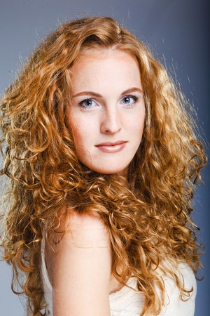 Portrait of beautiful lady on grey. Studio shotの写真素材