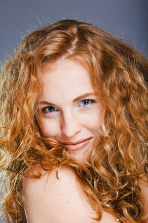 Portrait of beautiful lady on grey. Studio shotの写真素材