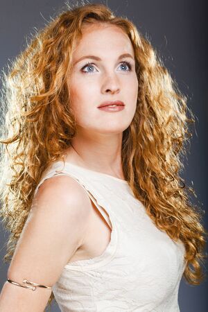 Portrait of beautiful lady on grey. Studio shotの写真素材