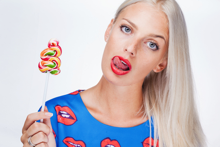 portrait of a girl with lollipopの写真素材