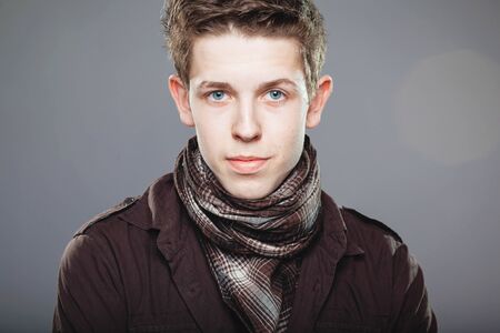 attractive young man wearing elegant shirt and  scarfの写真素材