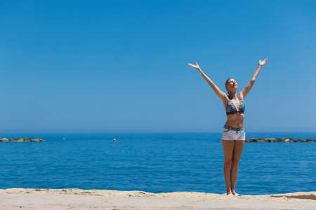 Young woman enjoying beautiful day at the beach. Cyprusの写真素材