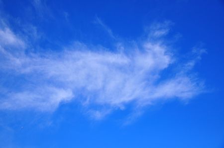 Vivid blue sky with mysterious cloudsの写真素材