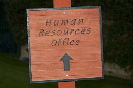 Outdoor sign pointing to Human Resources Officesの写真素材