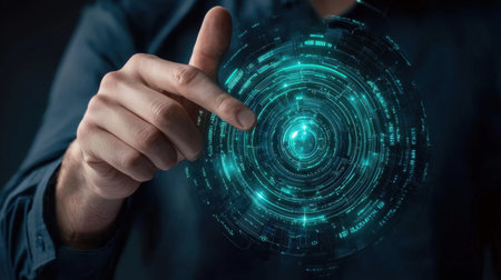 A hand interacts with a glowing digital interface, showcasing a futuristic design. This image represents technology innovation and user experience in a modern world.の素材