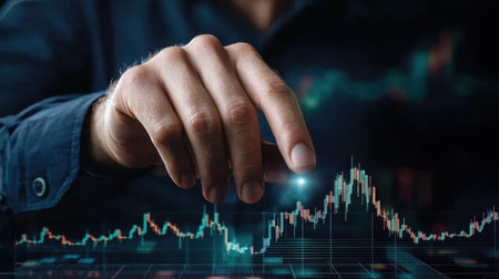 A business professional examines stock market trends using advanced data visualization techniques. The focused analysis showcases financial growth and investment opportunities.の素材