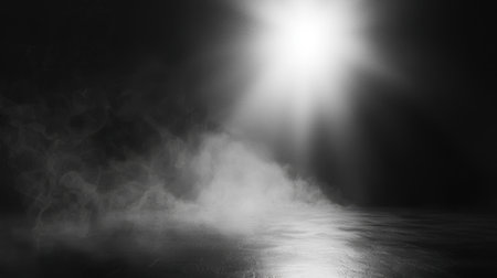 This monochrome image features ethereal light enveloping mist, creating a serene and mysterious atmosphere. Ideal for artistic concepts and backgrounds.の素材