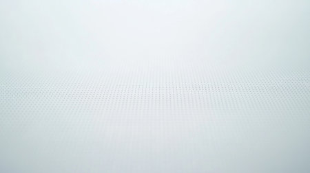 Soft white background with a subtle dotted texture, ideal for minimalist designs or contemporary art projects. Perfect for clean and elegant aesthetics.の素材