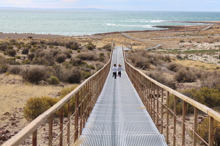 Kids running to the beach. Cabo Dos Bahias, Patagonia, Argentina.の写真素材