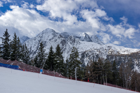 Skiing below the clouds in Ponte di Legnoの写真素材