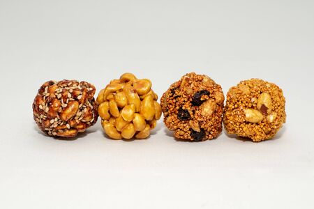 four in a row typical mexican seeds candies nuts peanuts honey amaranth white background isolated