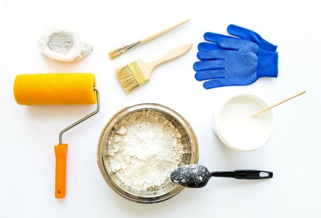 Set of house repair constructing and painting equipment on white background. White, blue, yellow composition. Flat lay, top viewの写真素材