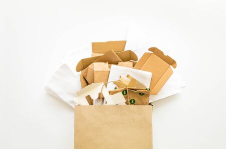 Composition with brown and white eco paper, from used boxes, packages, bags, prepared for recycling. Reduce, Reuse and Recycle concept. Flat lay, view from aboveの写真素材