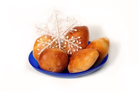 Five sweet and freshly baked pastries on a blue platter.の写真素材