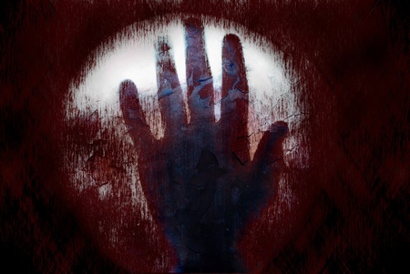 The bloody hand on the dark spooky textureの写真素材