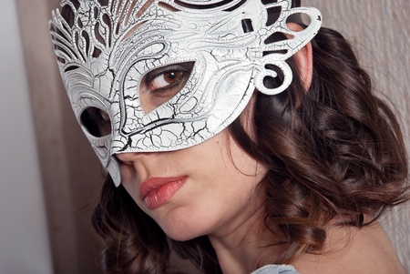 Beautiful woman in black and white masquerade mask.の写真素材