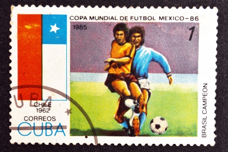 CUBA CIRCA 1985: stamp printed by CUBA, shows Football World Cup Mexico-86 - Champion of Brazil - Chile, 1962 , CIRCA 1985のeditorial素材