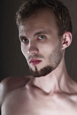 Portrait of a young man in a lower key の写真素材