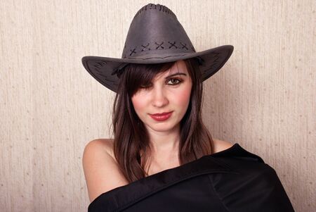 Portrait sexy girl in cowboy hat looking at camera の写真素材