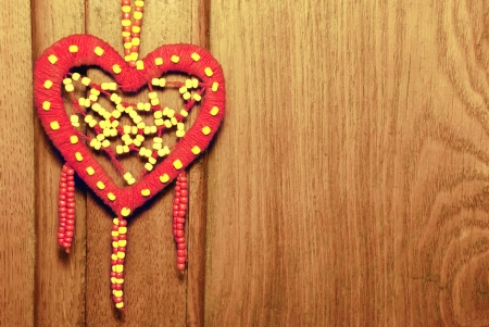 Red heart on the old wood background の写真素材