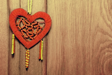 Red heart on the old wood background の写真素材