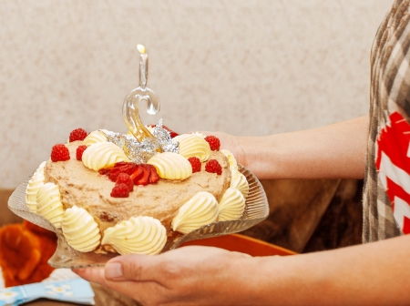 Birthday Cake of the biennium in the hands of the mother.の写真素材