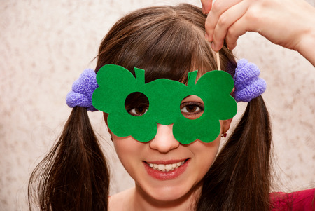 Cheerful pretty funny woman in carnival mask.の写真素材
