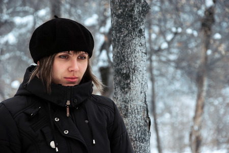Lonely Girl outdoors in cold winter weatherの写真素材