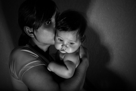 Black and white portrait of happy mother with baby.の写真素材