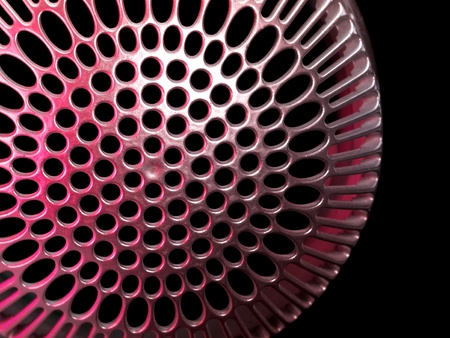abstract detail of a red illuminated metallic cover in black back