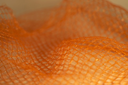 wavy orange net backgroundの写真素材