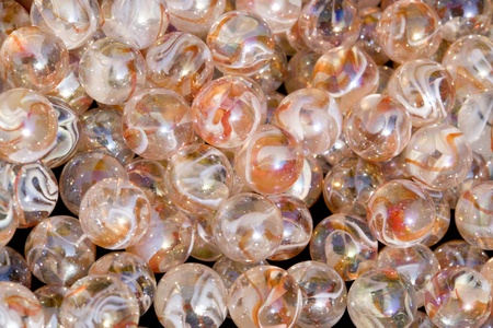 abstract full frame background with lots of colorful marbles made of glassの写真素材